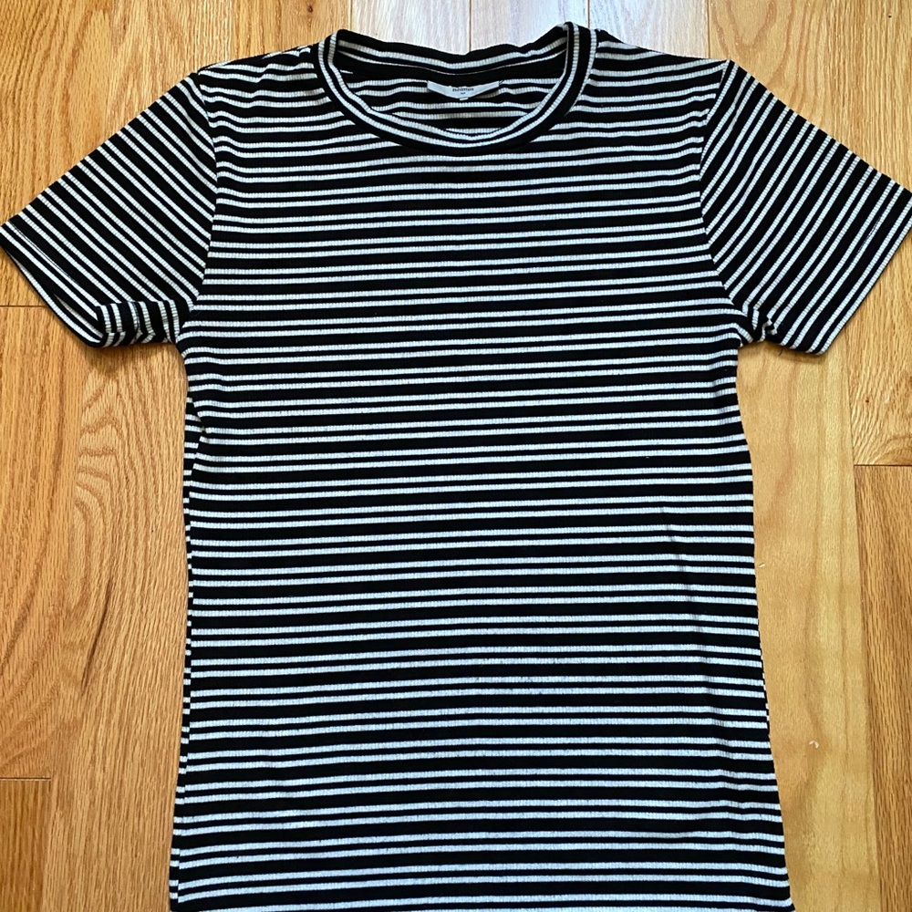 Black and white striped t-shirt.